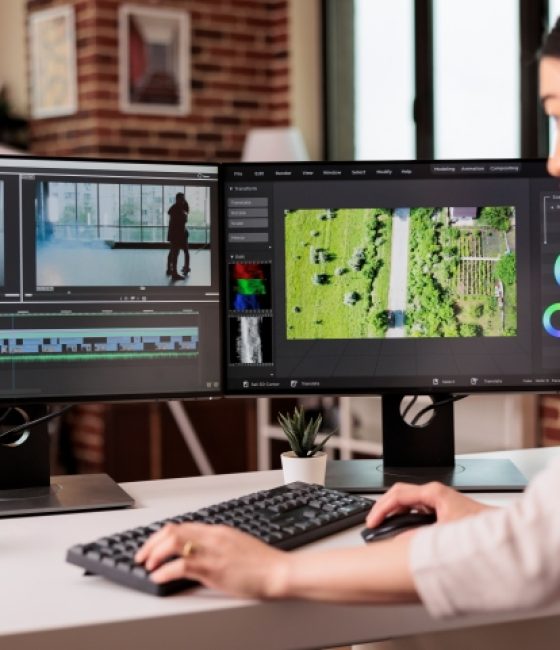 Video editor editing audio film montage Video editor editing audio film montage with post production software on computer. Videographer working on movie footage edit with color grading and visual or sound effects at home.